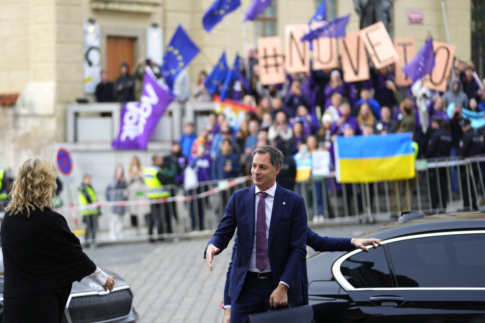 Belgium's Prime Minister Alexander De Croo, center, arrives for an EU Summit at Prague Castle in Prague, Czech Republic, Friday, Oct 7, 2022. European Union leaders converged on Prague Castle Friday to try to bridge significant differences over a natural gas price cap as winter approaches and Russia's war on Ukraine fuels a major energy crisis. (AP Photo/Petr David Josek)