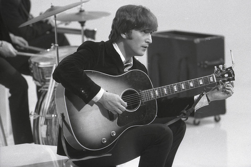 john lennon playing guitar