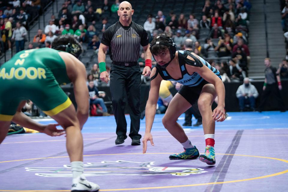 Pueblo West's Tom Cruz faces off against Javani Majoor of Falcon during their 157-pound first round matchup in the Class 4A state tournament at Ball Arena on Thursday, Feb. 16, 2023.