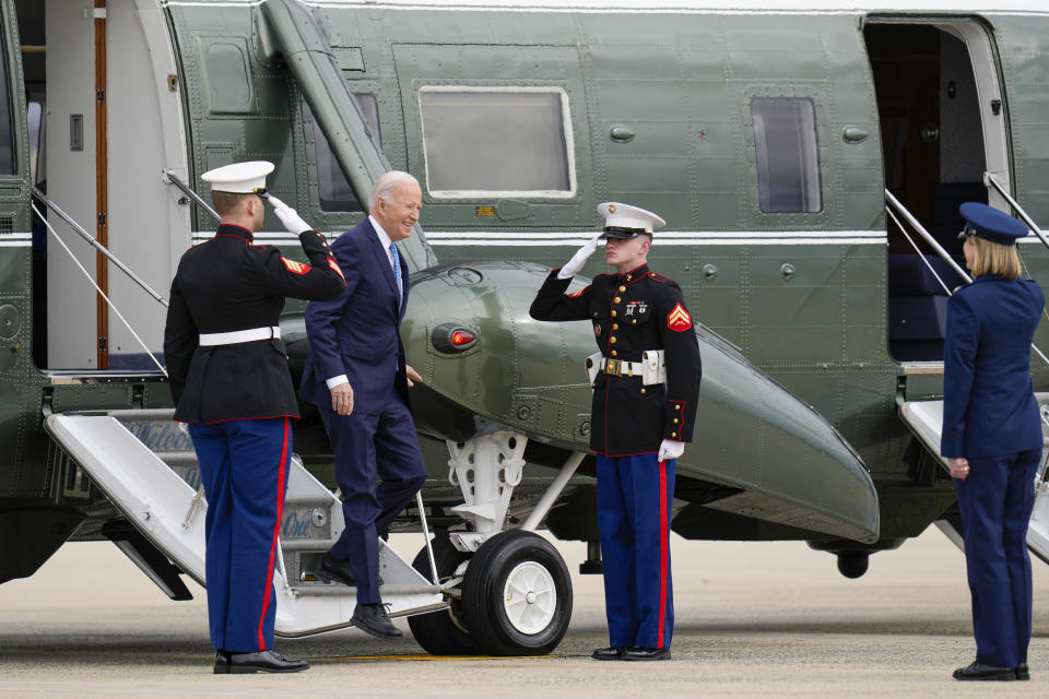 President Joe Biden steps off Marine One and is greeted by Col. Angela Ocho, before he boards Air Force One at Andrews Air Force Base, Md., Tuesday, Jan. 30, 2024, en route to Florida. (AP Photo/Jess Rapfogel)