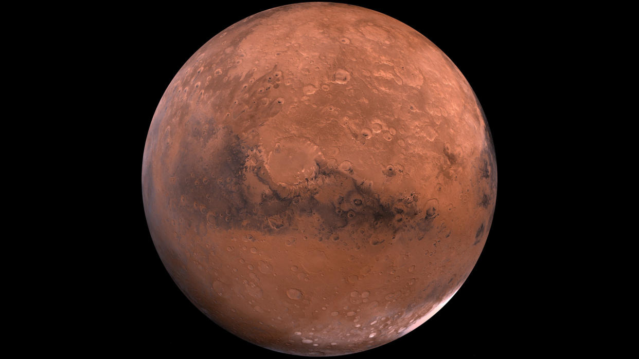  planet mars seen as a globe with the black of space in behind 