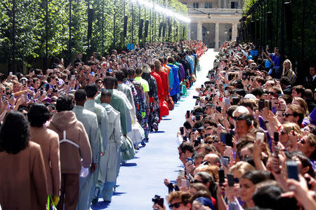 Models present creations by designer Virgil Abloh as part of his Spring/Summer 2019 collection show for Louis Vuitton fashion house during Men's Fashion Week in Paris, France, June 21, 2018. REUTERS/Charles Platiau