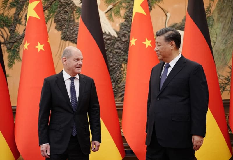 President of China Xi Jinping (R) receives German Chancellor Olaf Scholz in the East Hall of the Great Hall of the People. Kay Nietfeld/dpa Pool/dpa