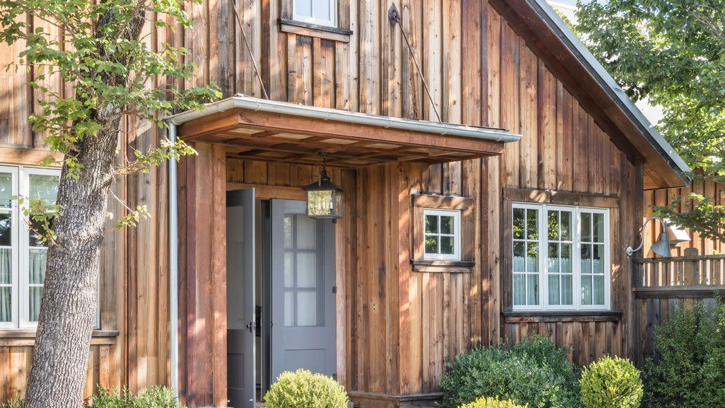 exterior of barn in sonoma, california with weathered cedar siding intact designed by victoria hagan planters chateau sonoma