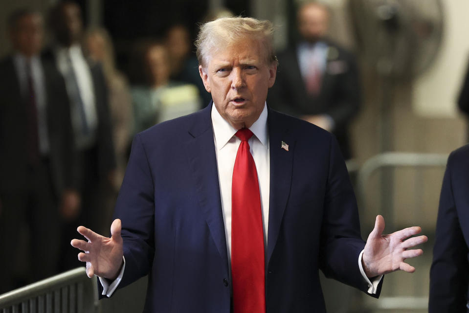 Former President Donald Trump speaks upon arriving at Manhattan criminal court, Tuesday, April 23, 2024, in New York. (AP Photo/Yuki Iwamura, Pool)