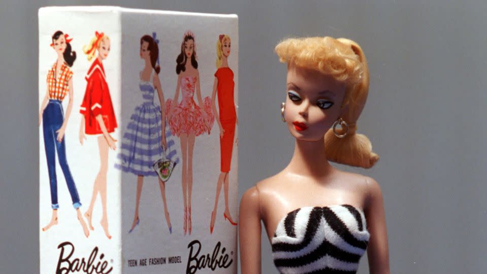 A Barbie from 1959 shown with swimsuit, stand and trademark box. - Don Bartletti/Los Angeles Times/Getty Images