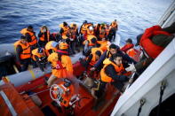 Refugees and migrants board the Turkish Coast Guard Search and Rescue ship Umut-703, off the shores of Canakkale, Turkey, after a failed attempt at crossing to the Greek island of Lesbos, November 9, 2015. REUTERS/Umit Bektas