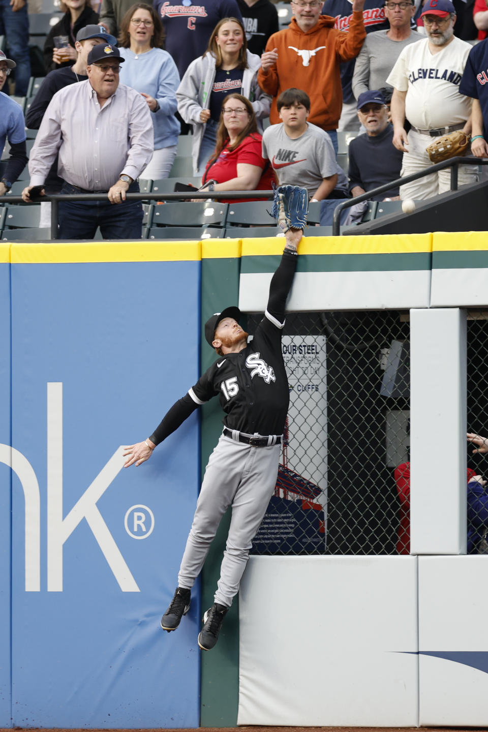 Chicago White Sox outfielder Clint Frazier makes a leaping attempt to catch a two-run home run by Cleveland Guardians' Mike Zunino during the seventh inning of a baseball game, Monday, May 22, 2023, in Cleveland. (AP Photo/Ron Schwane)