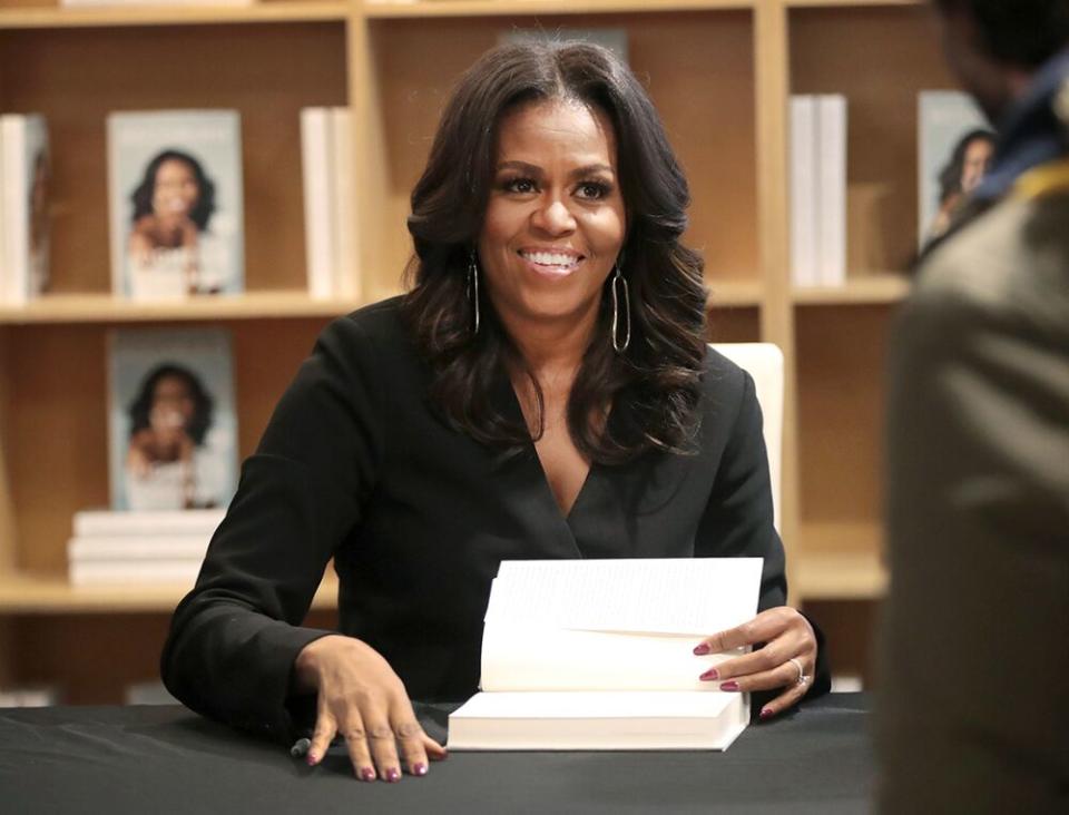 Former first lady Michelle Obama kicking off her book tour Chicago last year | Scott Olson/Getty