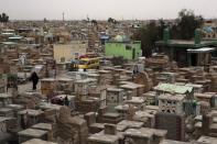 This Wednesday, Feb. 15, 2017 photo shows general view of the Wadi al-Salam, or "Valley of Peace" cemetery which contains the graves of Iraqi security forces and militiamen killed from fighting with Islamic State group militants, in Najaf, 100 miles (160 kilometers) south of Baghdad, Iraq. Hundreds of Iraqi soldiers are estimated to have died in the fight for Mosul so far, but the Iraqi government does not release official casualty reports, a move that many Iraqis view as disrespectful of their sacrifice. (AP Photo/ Khalid Mohammed)