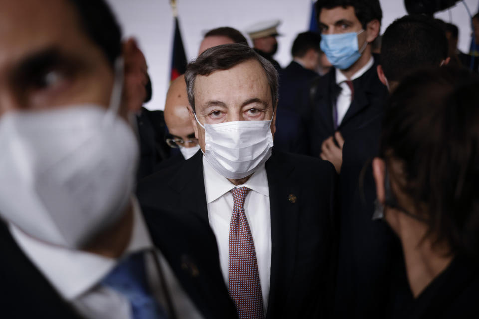 Italian Prime Minister Mario Draghi leaves after a conference on Libya in Paris Friday, Nov. 12, 2021. France is hosting an international conference on Libya on Friday as the North African country is heading into long-awaited elections next month. (Yoan Valat/Pool Photo via AP)