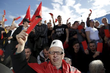 A man wearing a traditional Albanian hat attends an anti-government protest in Pristina, Kosovo February 17, 2016. REUTERS/Marko Djurica