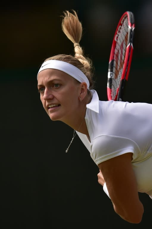 Czech Republic's Petra Kvitova serves against Japan's Kurumi Nara during their women's singles second round match of the Wimbledon Championships, at the All England Tennis Club in south-west London, on July 2, 2015