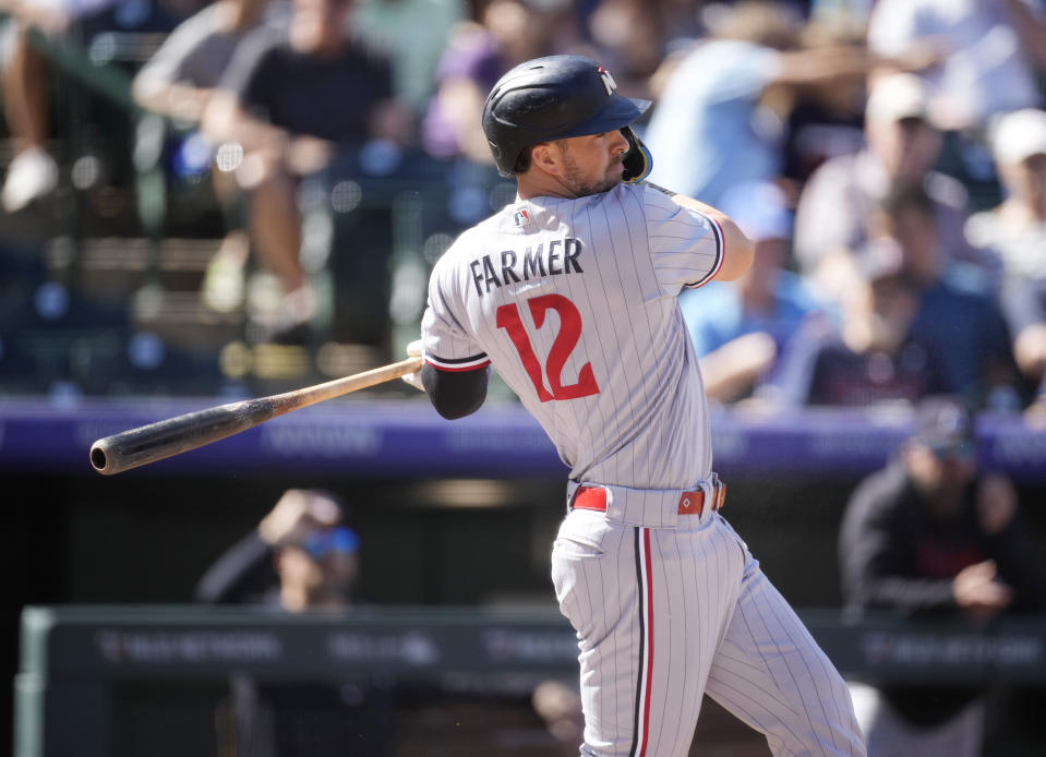 Minnesota Twins' Kyle Farmer grounds out against Colorado Rockies relief pitcher Brent Suter to end the top of the first inning of a baseball game, Sunday, Oct. 1, 2023, in Denver. (AP Photo/David Zalubowski)