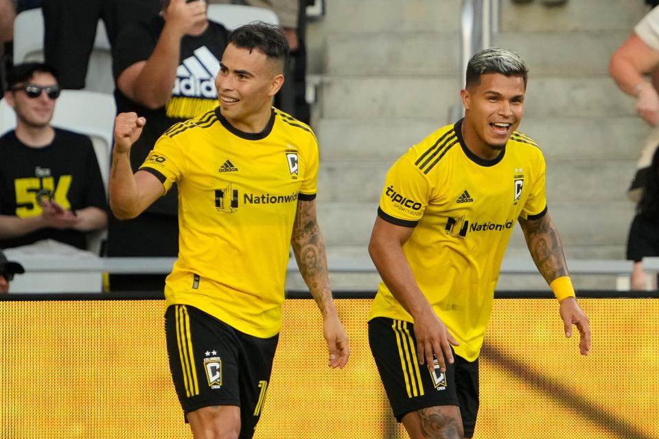 Aug 6, 2022; Columbus, Ohio, USA; Columbus Crew midfielder Lucas Zelarayan (10) celebrates scoring a goal with forward Cucho Hernandez (9) during the first half of the MLS game at Lower.com Field. Mandatory Credit: Adam Cairns-The Columbus Dispatch