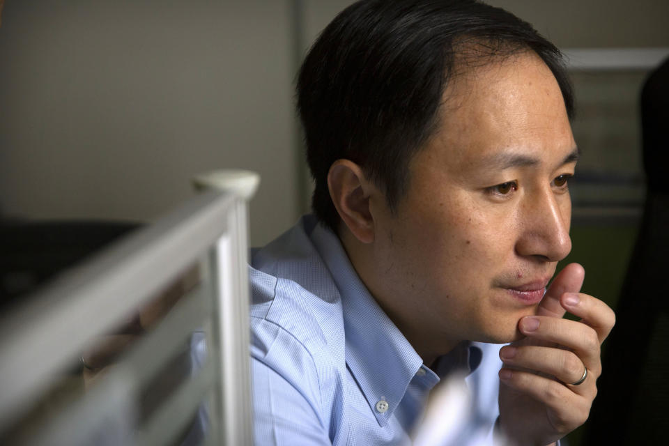 FILE - Chinese scientist He Jiankui looks at a computer screen while working at a lab in Shenzhen in southern China's Guandong province, Oct, 10, 2018. The disappearance of tennis star Peng Shuai in China following her accusations of sexual assault against a former top Communist Party official has shined a spotlight on similar cases involving political dissidents, entertainment figures, business leaders and others who have run afoul of the authorities. (AP Photo/Mark Schiefelbein, File)