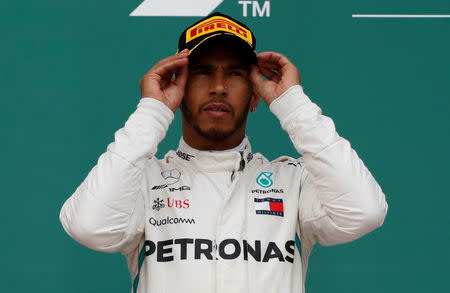 Formula One - F1 - Azerbaijan Grand Prix - Baku City Circuit, Baku, Azerbaijan - April 29, 2018 Mercedes' Lewis Hamilton celebrates on the podium after winning the race REUTERS/David Mdzinarishvili