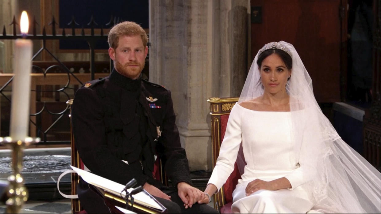 At one point in the ceremony, Harry could be seen touching the diamonds in Meghan’s ring which once belonged to his mother. [Photo: Getty]