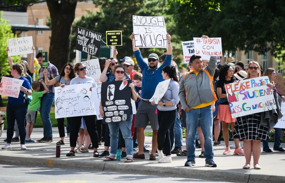 Local educators, parents, and students rally in front of the state Capitol Tuesday, June 7, 2022, calling on legislators to help mitigate school violence by passing sensible gun safety laws, and providing schools with the mental health resources they need. The event was organized by the Michigan Education Association.