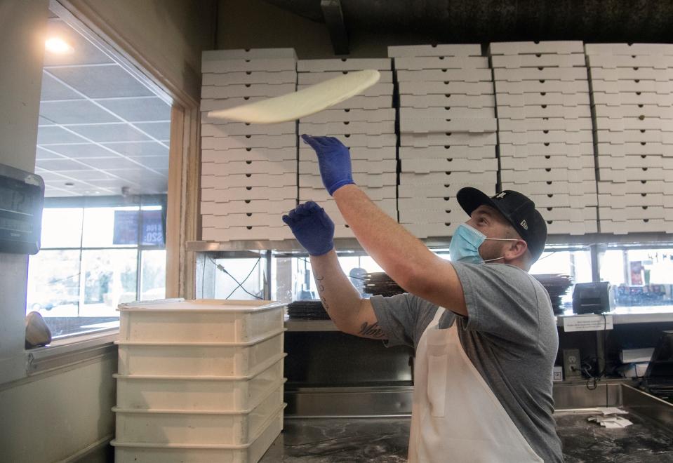 Anthony Perez makes a pizza at Michael’s New York Style Pizza at 2300 W. Alpine Ave., Stockton. The restaurant, along with adjoining Gina’s Cafe, will be participating in the 2022 Stockton Restaurant Week Jan. 14 to Jan. 23.