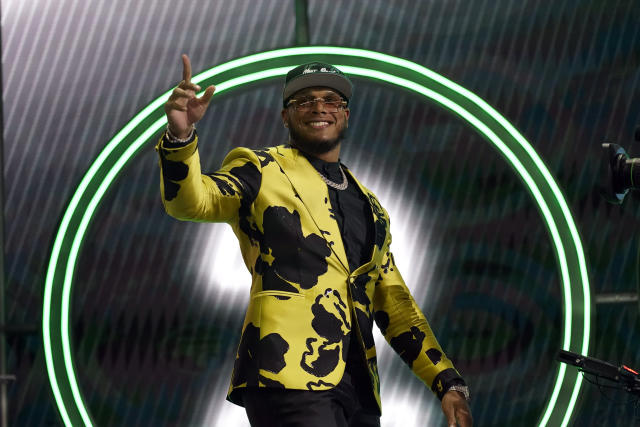 From left to right, Ahmad Gardner, Jermaine Johnson and Garrett Wilson pose  for a portrait while holding New York Jets jerseys Friday, April 29, 2022,  in Florham Park, N.J. (AP Photo/Brittainy Newman