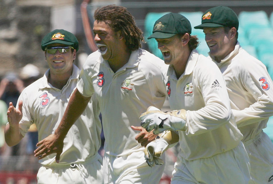 Andrew Symonds and Adam Gilchrist, pictured here celebrating a wicket during a Test match in 2006.