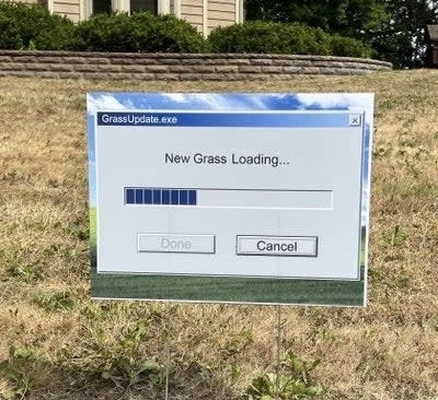 "New Grass Loading" sign