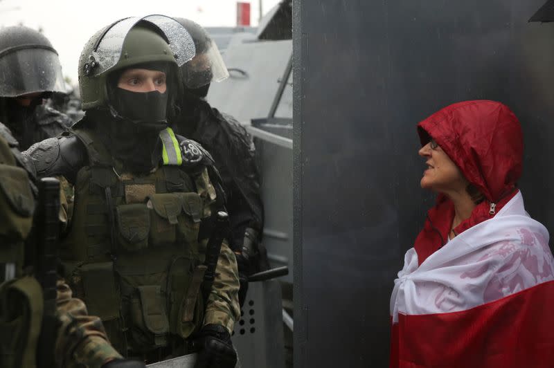 People attend an opposition rally to reject the presidential election results in Minsk