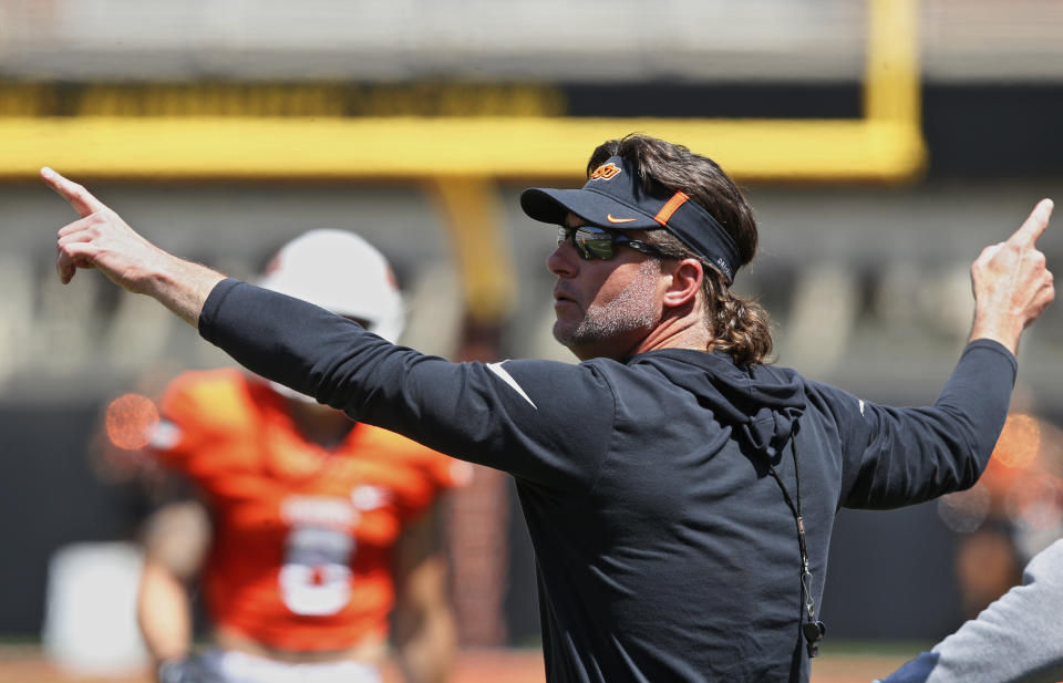 Oklahoma State head coach Mike Gundy gestures to his team during an NCAA college football intra-squad scrimmage in Stillwater, Okla., Saturday, April 28, 2018. (AP Photo/Sue Ogrocki)