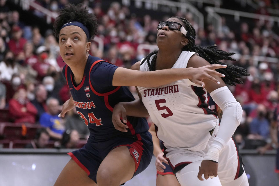 Stanford forward Francesca Belibi (5) battles for a rebound against Arizona forward Maya Nnaji (34) during the second half of an NCAA college basketball game Monday, Jan. 2, 2023, in Stanford, Calif. (AP Photo/Tony Avelar)