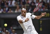 Roger Federer of Switzerland hits a shot during his Men's Singles Final match against Novak Djokovic of Serbia at the Wimbledon Tennis Championships in London, July 12, 2015. REUTERS/Toby Melville