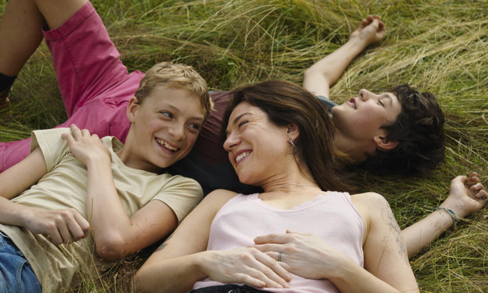 This image released by A24 shows, from left, Eden Dambrine, Émilie Dequenne and Gustav De Waele in a scene from "Close." (A24 via AP)