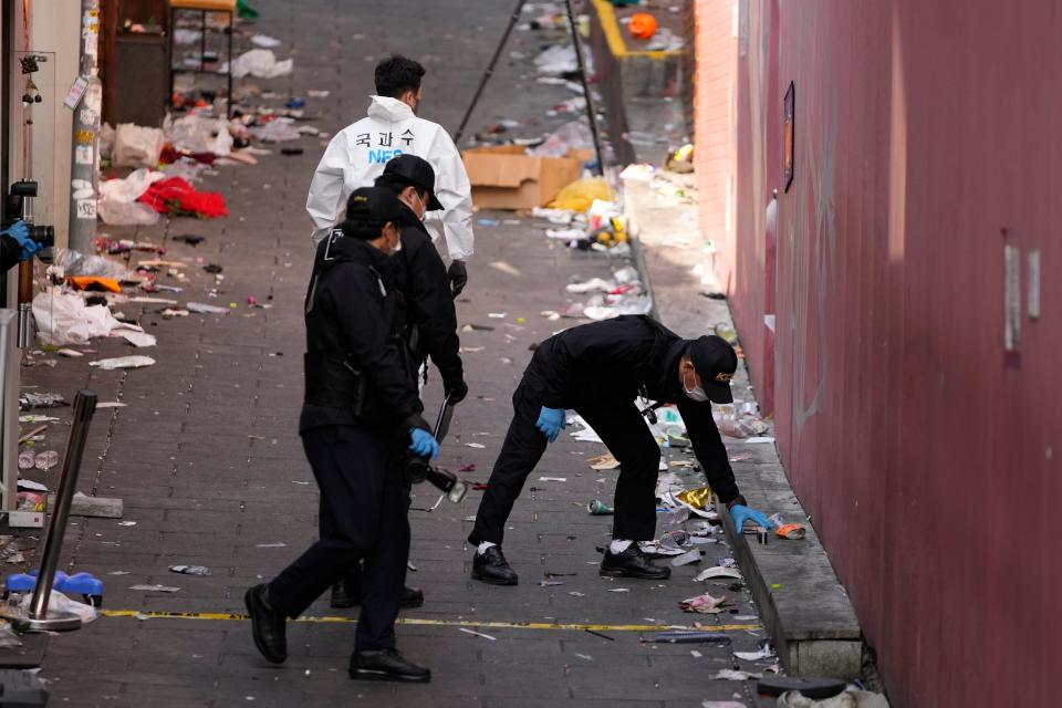 South Korean investigators inspect the scene of a deadly incident in Seoul, South Korea, on Monday.