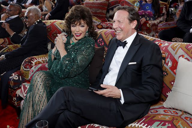 <p>Stefanie Keenan/VF24/WireImage for Vanity Fair</p> Dame Joan Collins and Percy Gibson