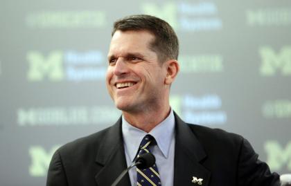 Jim Harbaugh, Michigan's new head football coach, addresses the media after after he was introduced on Tuesday, Dec. 30, 2014, in Ann Arbor, Mich. (AP Photo/Carlos Osorio)