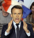 Independent centrist presidential candidate Emmanuel Macron gestures as he delivers a speech during a campaign meeting in Marseille, southern France, Saturday, April, 1, 2017. The two-round presidential election is set for April 23 and May 7. (AP Photo/Claude Paris)