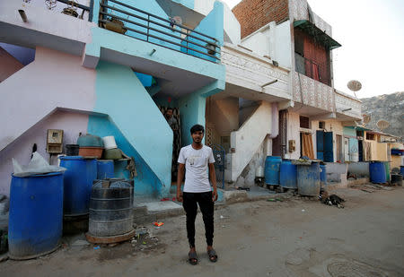 Mohammad Rafiq, 18, poses outside his house in Ahmedabad, April 12, 2019. REUTERS/Amit Dave