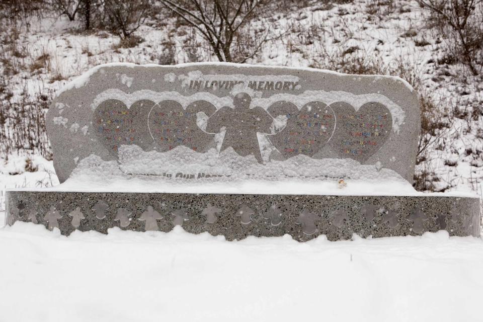 Snow flakes lie on The Rock of Angles memorial for the victims of the Sandy Hook Elementary School shooting in Newtown