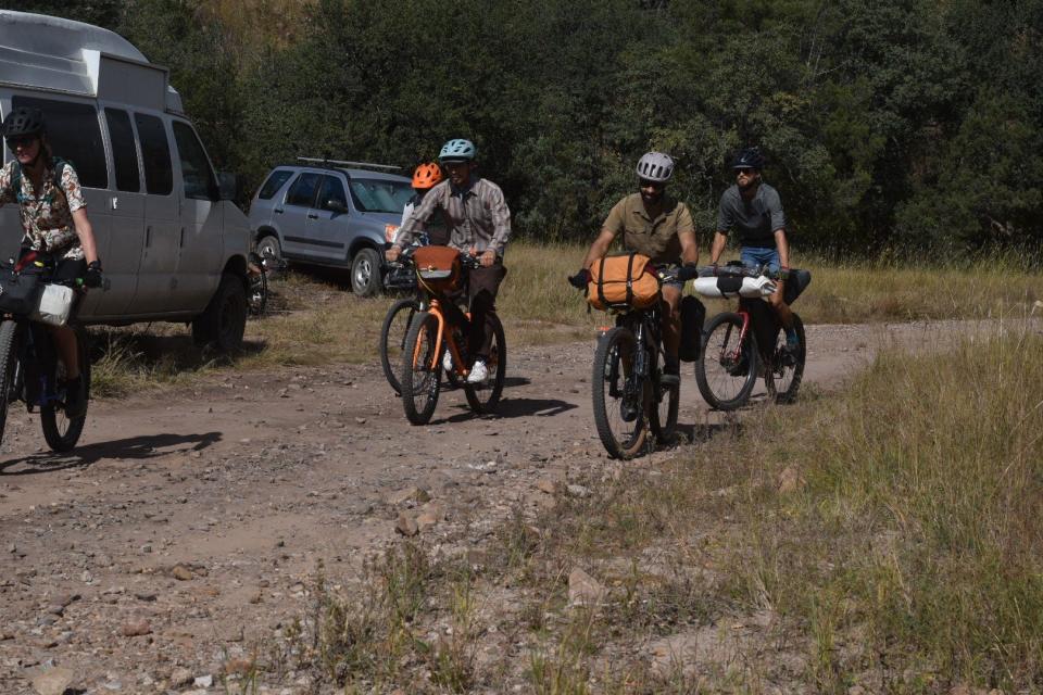 A group of cyclists, some from Tucson and Phoenix, embark on bike packing in Camp Rucker near Douglas, Arizona, on Oct. 22, 2022. Bike packing is like adventure cycling, like hiking but on a bike. Their packs carry food, water, tools to fix a bike and other necessities for a long ride.