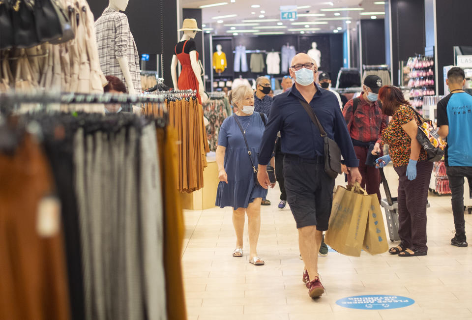 File photo dated 15/06/20 of customers wearing face masks as they shop inside Primark in Oxford Street, London. Face coverings could be made mandatory in shops in England, Boris Johnson has hinted, as he urged Britons to go back to work if they can.