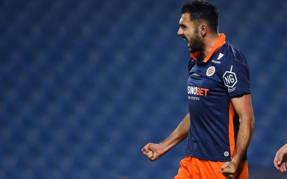 Montpellier's French forward Gaetan Laborde celebrates after scoring a goal during the French L1 football match between Montpellier and LOSC Lille at the Mosson stadium in Montpellier on December 23, 2020. - AFP