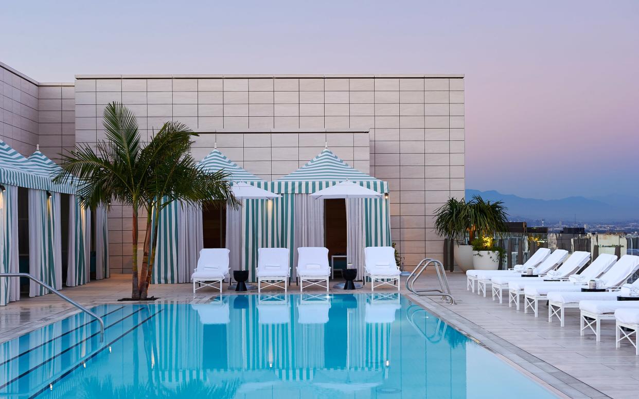 Waldorf Astoria Beverly Hills's sunny and posh roof deck with restaurant, saltwater pool and large hot tub is a good spot to relax - A 