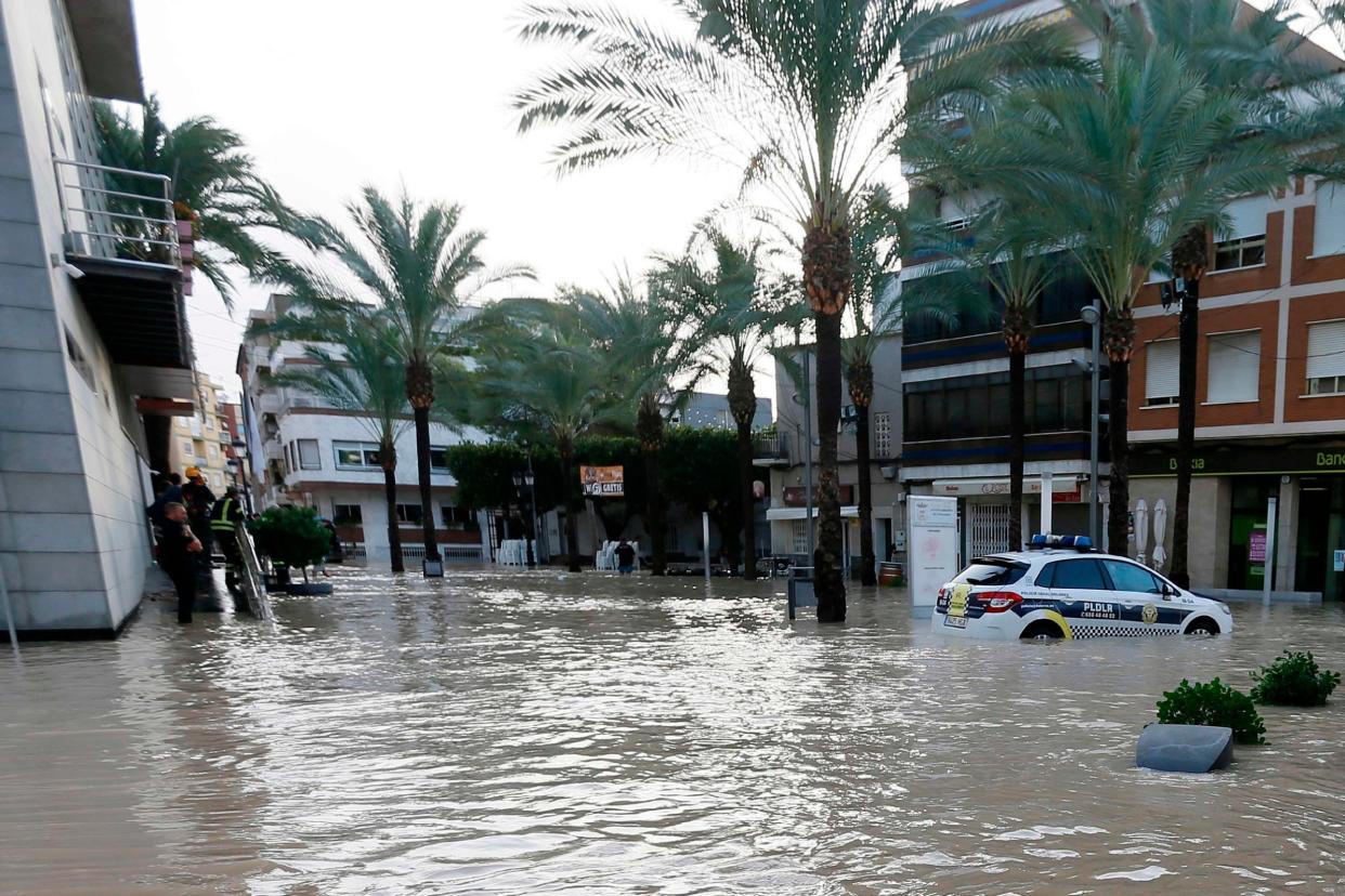 A police car is parked on a flooded street on September 14, 2019 in Dolores, as torrential rains hit southeastern Spain sparking major flooding in the Valencia region: AFP/Getty Images