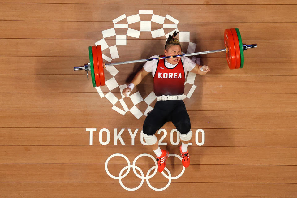 <p>TOKYO, JAPAN - AUGUST 01: Suhyeon Kim of Team South Korea competes during the Weightlifting - Women's 76kg Group A on day nine of the Tokyo 2020 Olympic Games at Tokyo International Forum on August 01, 2021 in Tokyo, Japan. (Photo by Chris Graythen/Getty Images)</p> 