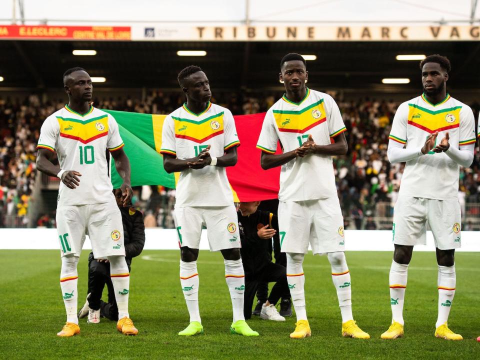 Sadio Mane, Krepin Diatta, Pape Matar Sarr and Boulaye Dia of Senegal stand side by side before a match.