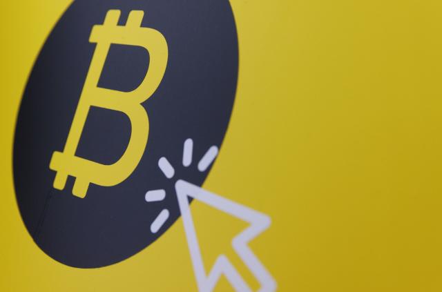 A Bitcoin logo in the window of a Bitcoin Change bureau in Tel Aviv, Israel.