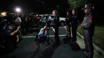 <p>Interim Austin police Chief Brian Manley, center, talks to the media after an explosion, Monday, March 19, 2018, in Austin, Texas. (Photo: Eric Gay/AP) </p>