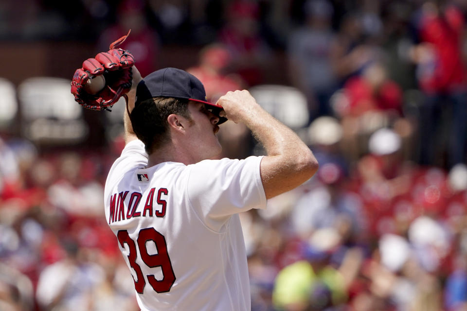 St. Louis Cardinals starting pitcher Miles Mikolas adjusts his cap after giving up a three-run home run to Milwaukee Brewers' Jace Peterson during the fifth inning of a baseball game Sunday, May 29, 2022, in St. Louis. (AP Photo/Jeff Roberson)