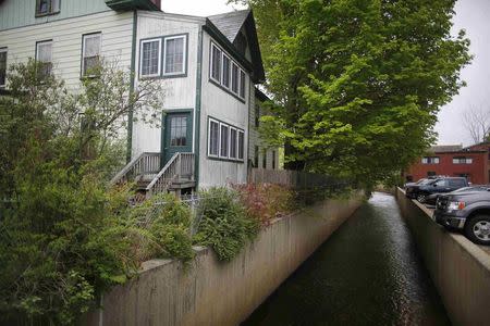 Beaver Brook, a source of large flooding, flows through downtown Keene, New Hampshire May 16, 2014. REUTERS/Brian Snyder