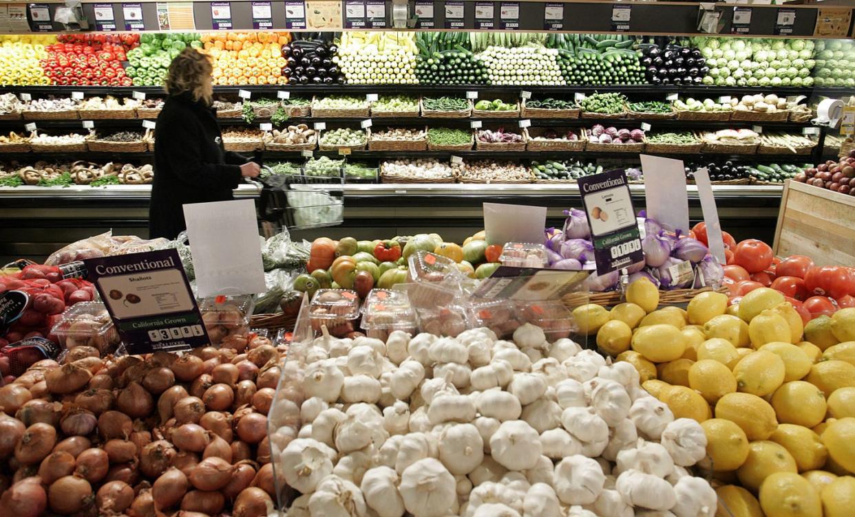 new york january 13 a woman shops in the produce section at whole foods january 13, 2005 in new york city new eating guidelines issued by the us government stress the need to eat more vegetables, fruits and whole grains and to excercise between 30 90 minutes a day to promote good health photo by stephen cherningetty images